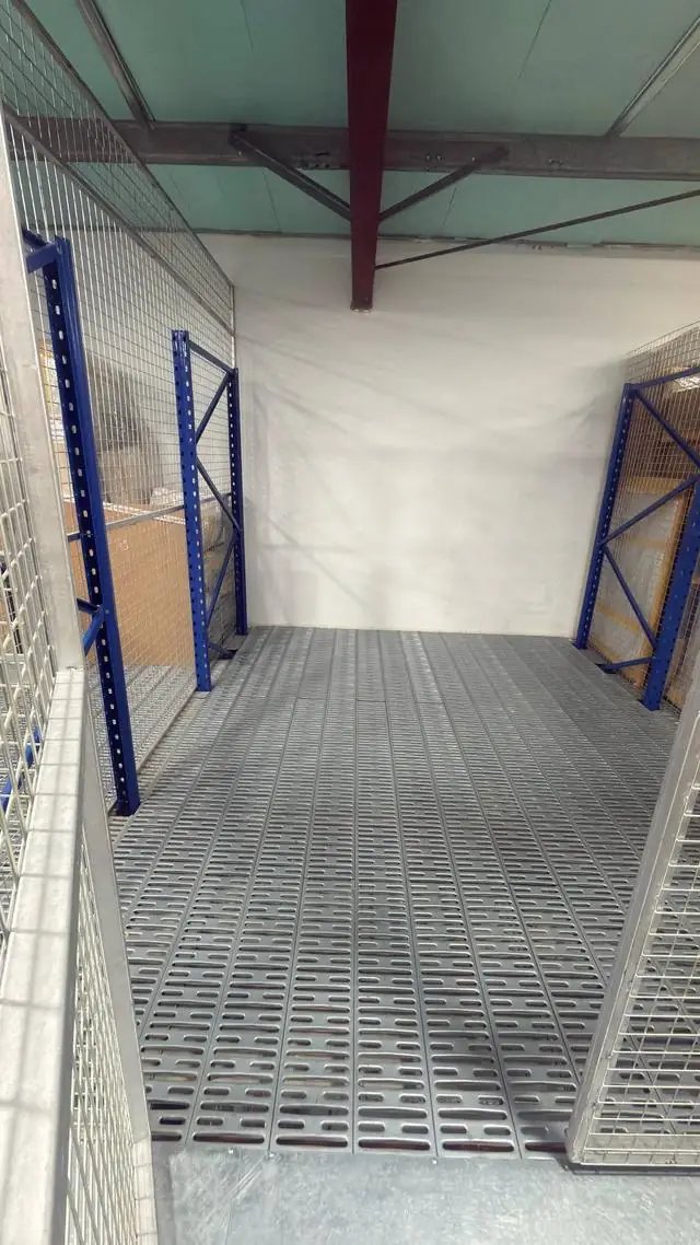 Empty private storage cage inside a QuickServe Relocations warehouse in Dubai