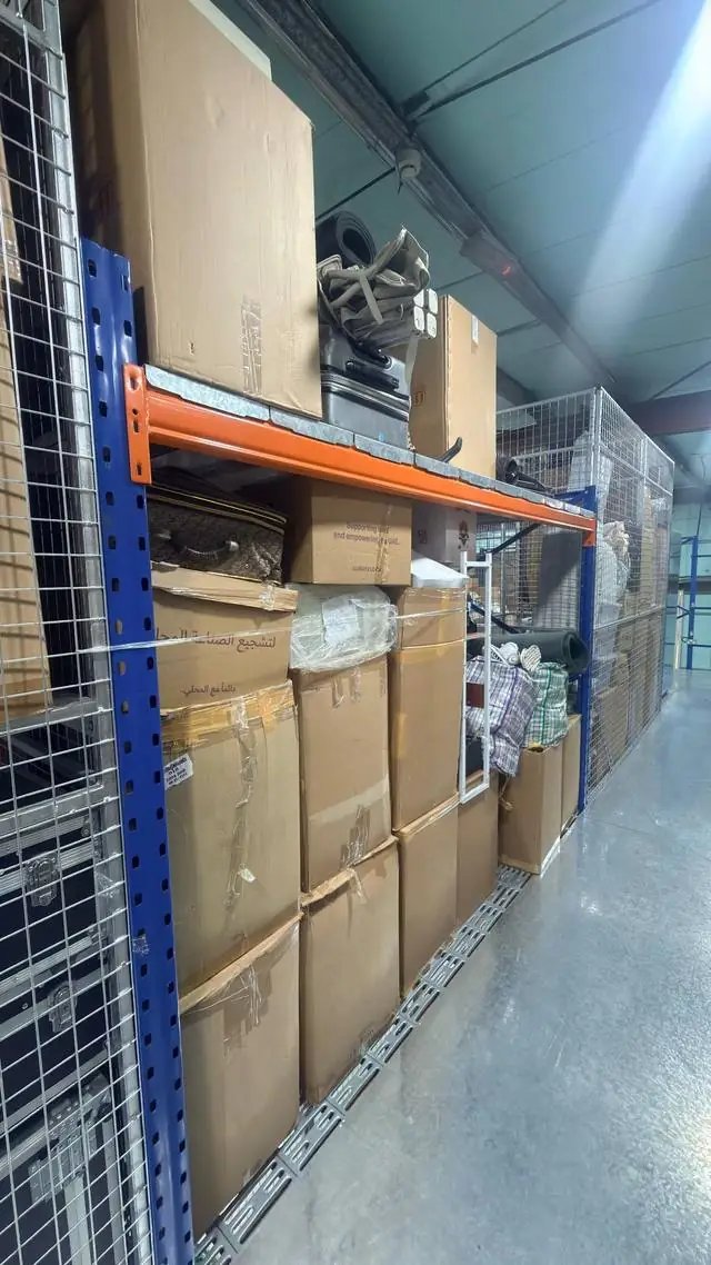 Boxes and furniture stored on steel racking in an air-conditioned Dubai warehouse